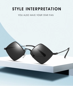 Detail of vintage rhombic sunglasses with black metal frames on a minimalist pedestal