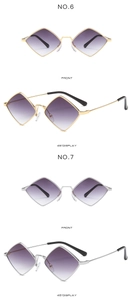 Detail of gold and silver rhombic sunglasses with purple gradient lenses and metal frames
