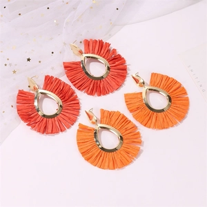 Bohemian fan-shaped raffia tassel earrings in red and orange with hollow gold frames