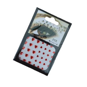 Selbstklebende rote Herz-Acryl-Strasssteine für Gesicht und Augen auf Kartenverpackung