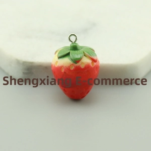 Macro detail of a 3D resin strawberry pendant with realistic seeds and a metal loop