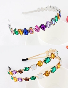 Detail of colorful rhinestones and mixed-cut gemstones on a vintage metal headband
