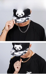 Detail of hip hop Cuban chain necklaces in gold and silver with rhinestone buckle on model