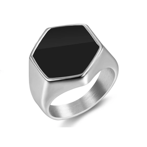 Macro detail of men's hexagonal ring showing brushed silver metal and black enamel inlay