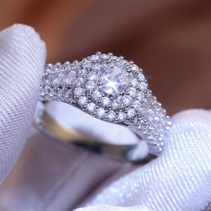 Macro shot of luxury princess ring with double halo diamonds and micro-pave band
