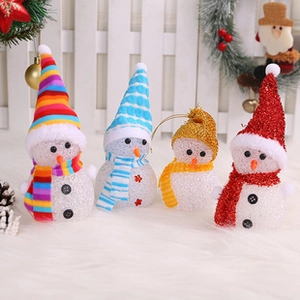 Detailed view of four colorful snowman figurines with festive holiday decorations