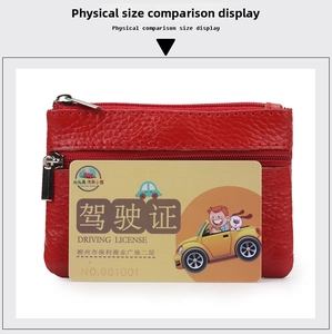 Detail of red pebbled leather coin purse featuring a compact dual zipper design
