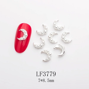 Detail of silver moon nail charms with white pearls and 7x8.5mm dimension markers