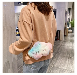 Rainbow gradient plush cloud bag with embroidery and gold chain shown on a shoulder