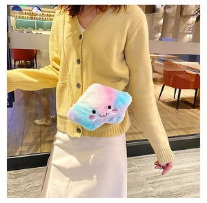 Detail of plush cloud bag featuring pastel gradient fur and cute cartoon embroidery