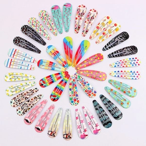 Colorful assortment of assorted pattern BB hair clips arranged in a circular display