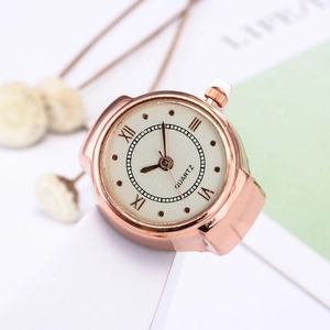 Elegant rose gold finger watch with Roman numerals and quartz movement on a white surface