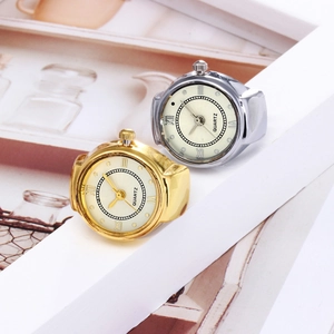 Detail of elegant gold and silver quartz ring watches with Roman numeral dials