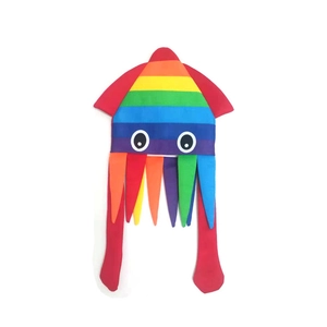 Detail of colorful rainbow striped squid party hat with large eyes and long tentacles