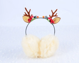 Detail of Christmas reindeer antler earmuffs featuring plush fabric and festive berry accents
