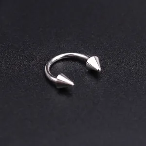 Close-up of 1mm stainless steel horseshoe ring with 8mm inner diameter and cone tips