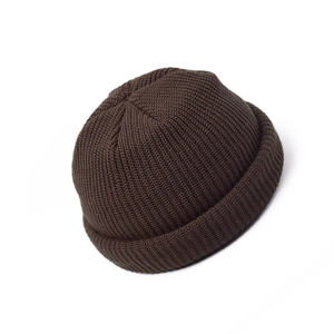 Close-up of deep brown rib-knit texture on a warm vintage miki hat for winter