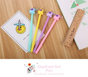 Close-up of four colorful cartoon elephant neutral pens on a wooden desk setting