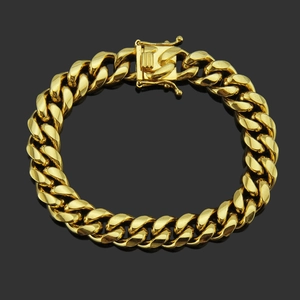 Gourmette cubaine dorée pour homme avec fermoir dragon sur fond noir brillant à reflets
