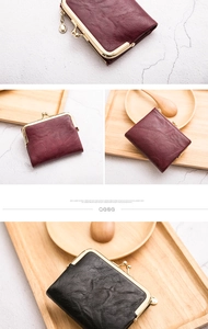 Macro detail of vintage leather wallets showing kiss-lock clasp and burgundy texture