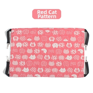 Detail of red cat hammock with cartoon patterns and four adjustable hanging metal hooks