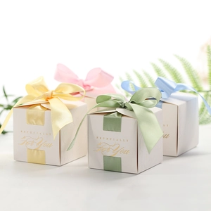 Elegant cubic wedding gift boxes in assorted colors with silk ribbons and gold lettering