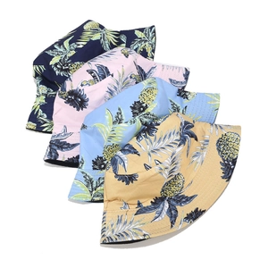 Breathable cotton reversible bucket hats with tropical pineapple and palm leaf patterns