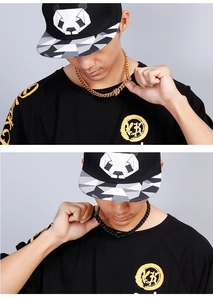 Close-up showing a male model wearing 18K gold and black stainless steel chain necklaces