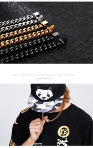 Detail of cubic zirconia paved clasp on gold, silver, and black cuban link chains