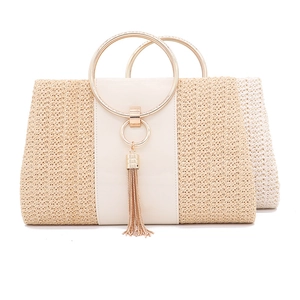 Beige straw woven evening handbag with round golden metal handles and tassel accent