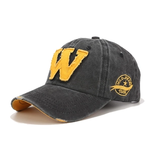 Distressed black baseball cap with yellow W embroidery and vintage washed cotton finish