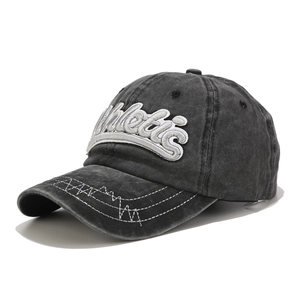 Detail of vintage washed baseball cap with white Athletic embroidery and wavy edge stitching
