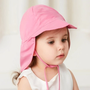 Close-up of pink children's sun hat featuring wide brim and long neck protection flap