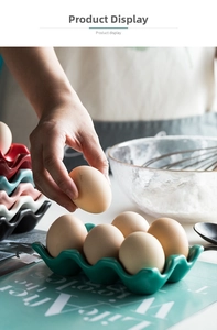 Macro shot of colorful ceramic egg trays with six wave grooves for kitchen organization