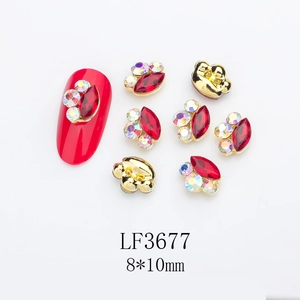 Detailed macro view of 8x10mm marquise alloy nail charm with ruby crystal and gold border
