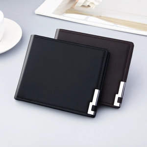 Slim men's bi-fold leather wallets in black and dark brown with metal corner detail