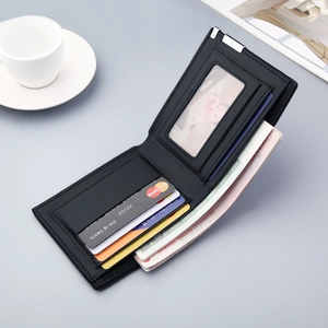 Slim men's black leather bifold wallet with multiple card slots and bill compartment
