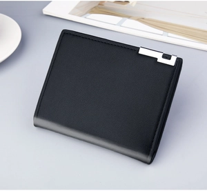 Close-up of black leather men's short wallet with fine grain and silver metal detail