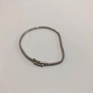 Detail view of silver tennis bracelet with cubic zirconia inlay and secure box clasp