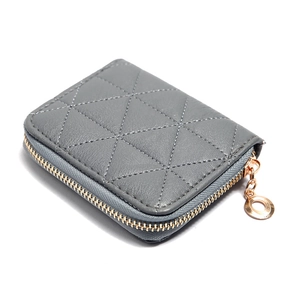 Grey quilted mini coin purse with gold zipper and metal ring puller on white back