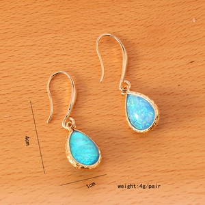 Macro detail of blue teardrop semi-precious stone earrings with dimensions and weight