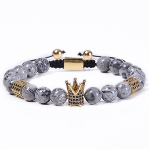 Natural 8mm map stone beaded bracelet with gold crown and black zircon accents on white base
