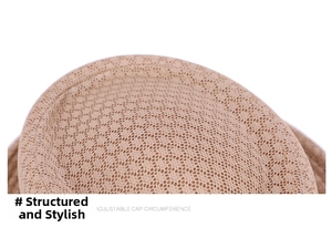 Detailed macro view of the breathable woven mesh texture on a beige sun straw hat