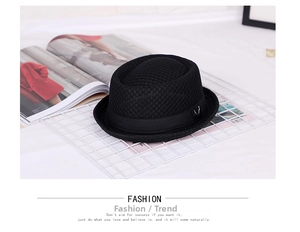 Detailed view of black breathable woven fedora with silk ribbon and silver stag accessory