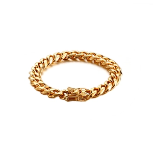 Polished gold Cuban link bracelet for men with secure press-lock clasp on white background