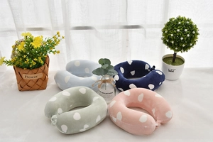 U-shaped memory foam neck pillows for kids with polka dot pattern in four soft pastel colors