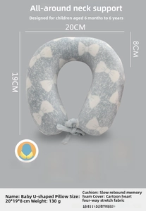 Gray memory foam U-shaped pillow for kids featuring white bow patterns and storage cord
