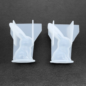 Detailed view of two translucent rabbit-shaped silicone molds for DIY resin casting projects