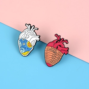 Artistic anatomical heart brooches with Starry Night design and Love Hurts bandage text