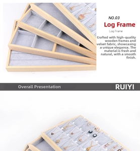 Close-up of wooden jewelry tray with soft grey velvet lining and multi-grid storage slots